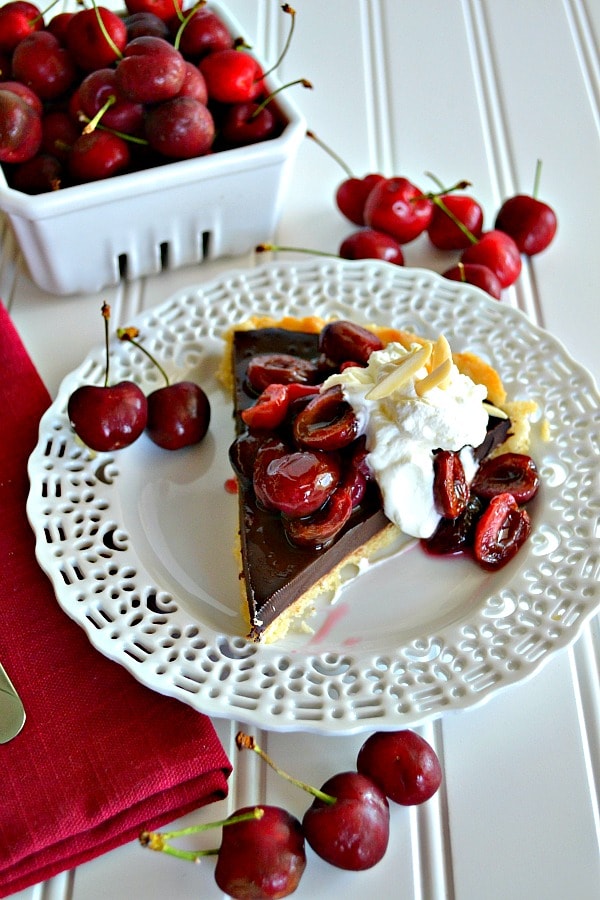 This Chocolate Cherry Tart with Almond Whipped Cream is the perfect treat for any chocolate lover in your life!