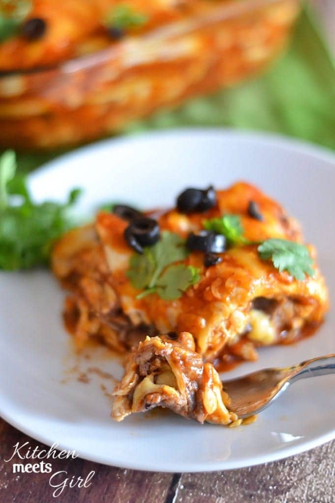 This Cheesy Chicken Enchilada Casserole uses a quick and easy marinade that comes together in a snap, and makes dinnertime a breeze! #recipe #chicken #casserole #mexican