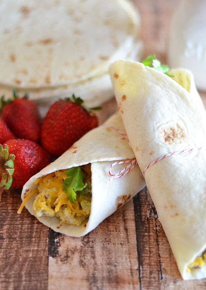 At $1.99 a serving, this one-minute breakfast burrito is healthier and faster than anything than you can grab at the drive-through window! #eggs #breakfast #recipe