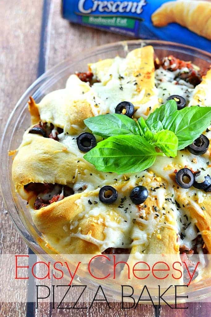 Need dinner on the table in 30 minutes or less? The whole family will love this easy cheesy pizza bake! Get the recipe at www.kitchenmeetsgirl.com! #recipe #pizza #crescent rolls