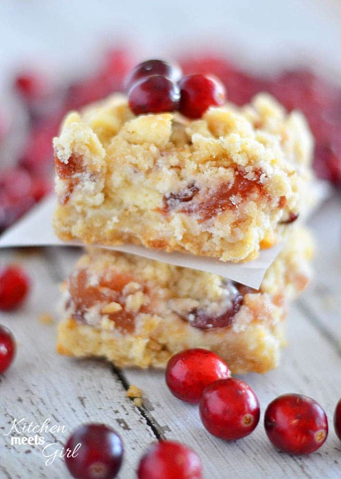 White chocolate, cream cheese, and pie filling are the perfect combination in these easy to make Apple Cranberry Cheesecake Bars.