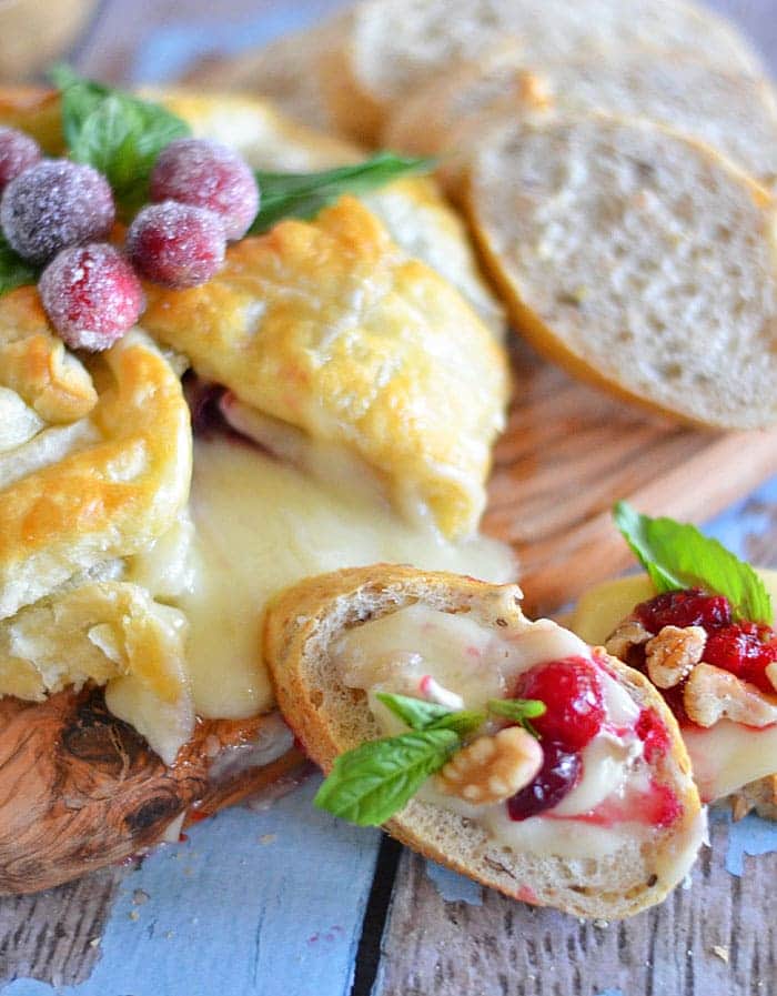 Need a quick and easy, yet impressive appetizer? Look no further than this Cranberry and Walnut Brie with Sugared Cranberries!