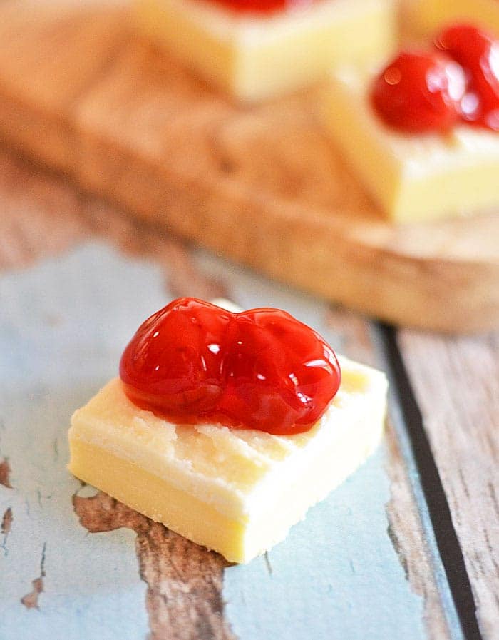 This White Chocolate Cherry Fudge requires only the microwave, and uses a special ingredient to make it extra light and fluffy! #recipe #fudge #white chocolate