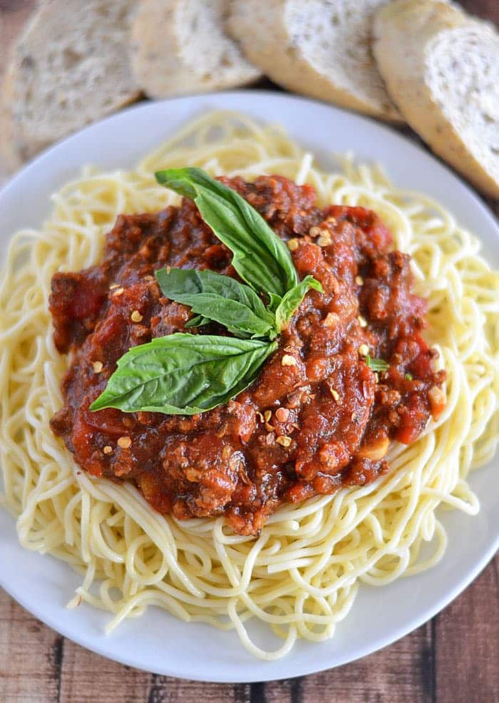 This slow cooker spaghetti sauce is the perfect solution for busy nights. Filled with lean beef and lots of Italian flavors, this sauce just screams comfort food!