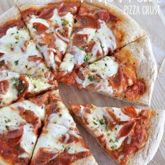 This Homemade Whole Wheat Pizza Crust is my family's favorite: it has a great nutty flavor, and bakes up soft and chewy - better than anything at any pizzeria!