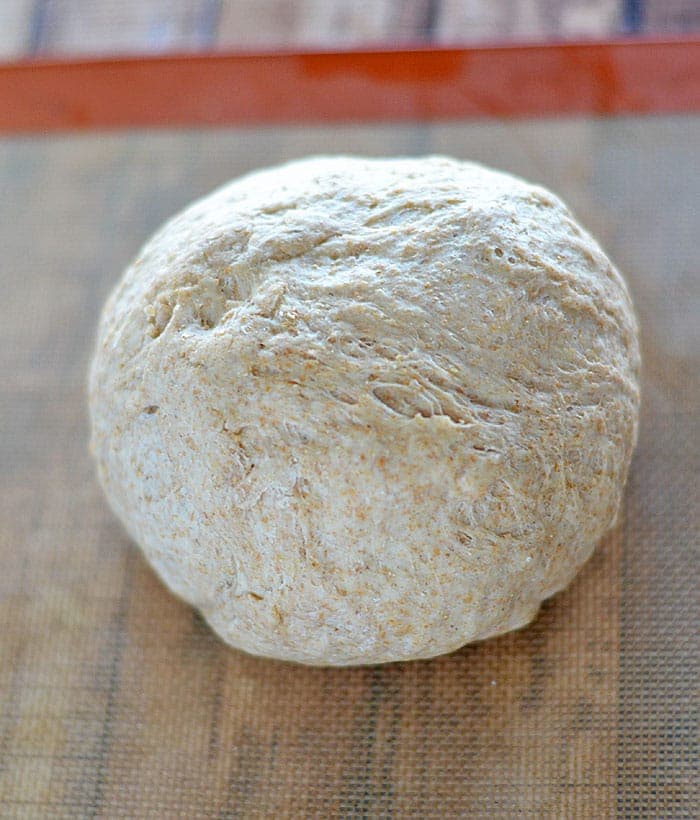 This Homemade Whole Wheat Pizza Crust is my family's favorite: it has a great nutty flavor, and bakes up soft and chewy - better than anything at any pizzeria!