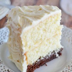 This Vintage Cake combines two layers of white cake, with a surprise brownie layer soaked in a decadent chocolate sauce. And the cream cheese frosting takes it right over the top!