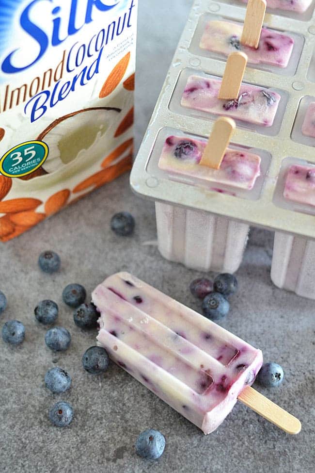 It's summertime, and that means cooling off with icy treats! With a blend of Greek yogurt, Silk Almond-Coconut Blend, and roasted berries, these Blueberry Coconut Popsicles are a guilt-free treat the whole family can enjoy!