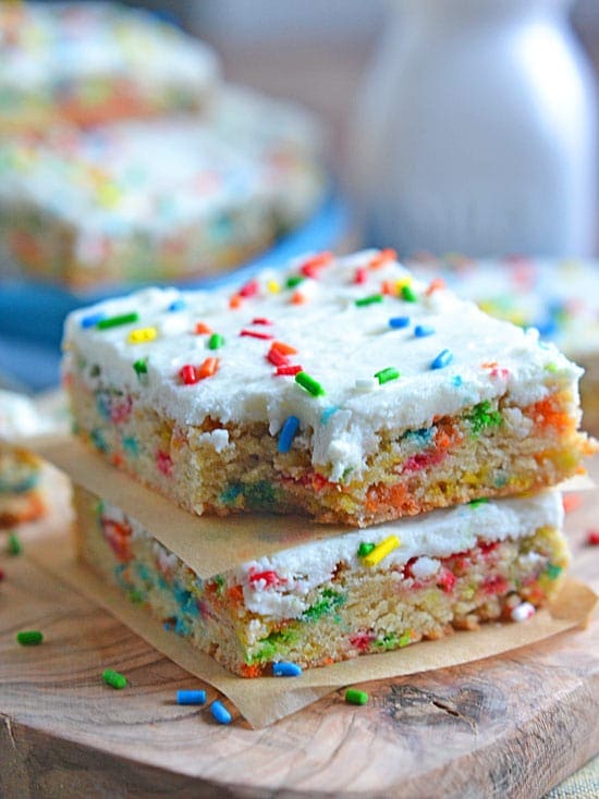 These Cake Batter Blondie Bars are filled with cake batter flavor, without the use of a cake mix. And you can't go wrong with any dessert that is packed with sprinkles!