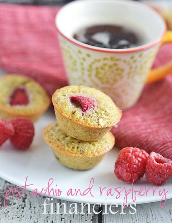 Pistachio and Raspberry Financiers are the perfect little sweet to serve when you want a fun pick me up. Made with a base of pistachio and topped with one tart raspberry, these elegant but easy treats are the perfect accompaniment to coffee or tea.
