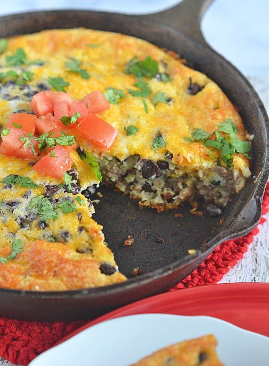 This Mexican Skillet Breakfast Casserole is sure to satisfy hungry family and friends. Filled with sausage, cheese and veggies, this hearty breakfast can be prepared the night before, making busy mornings stress-free!