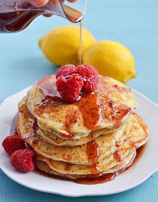 With a sprinkling of poppy seeds, lots of lemon juice and lemon zest, these Lemon Poppy Seed Pancakes make a great weekend breakfast. Take them over the top by drizzling with an easy to make raspberry syrup!